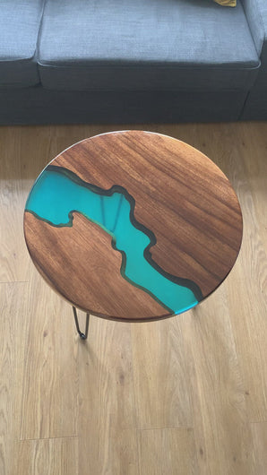 detailed video of luxury walnut resin river table with glossy finish 